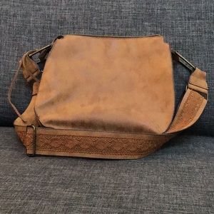 Brown cross body purse with guitar style strap